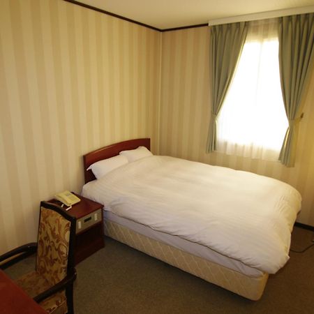 Tsukubanoyu Urban Hotel Værelse billede