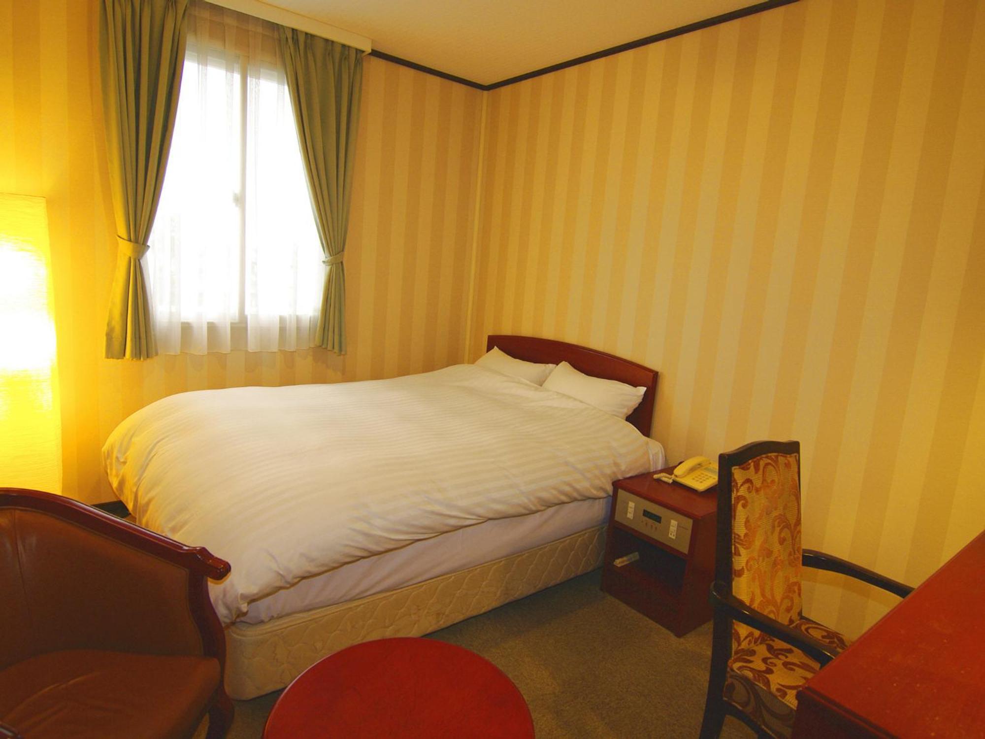 Tsukubanoyu Urban Hotel Værelse billede